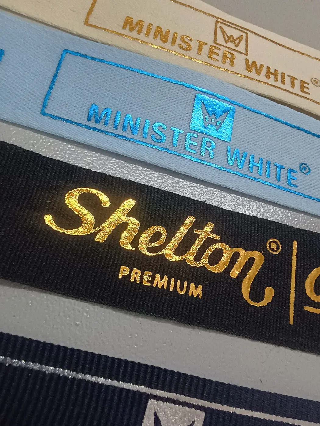 Textile label samples with metallic foil printing