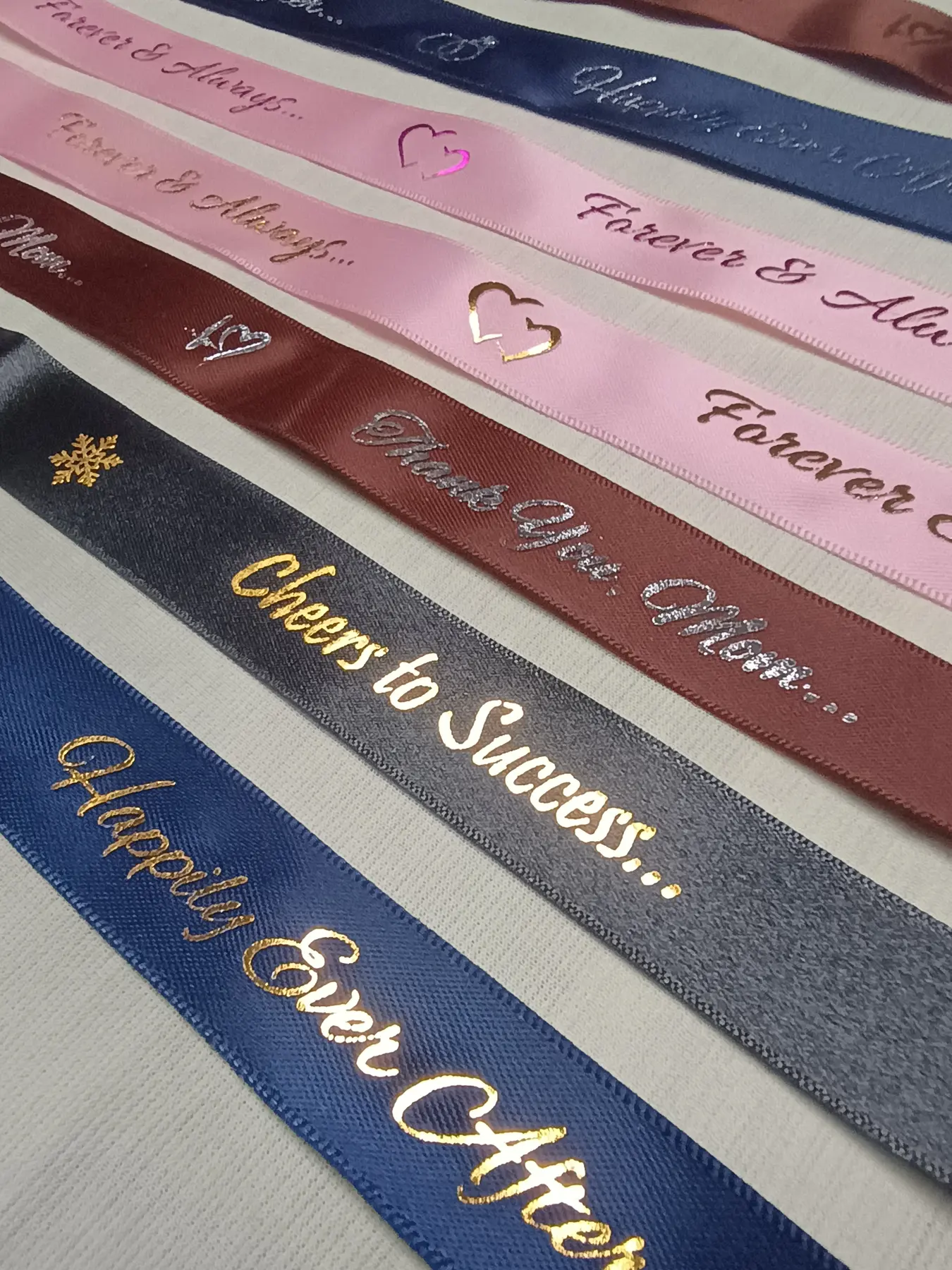 Assorted satin ribbons with custom foil printing