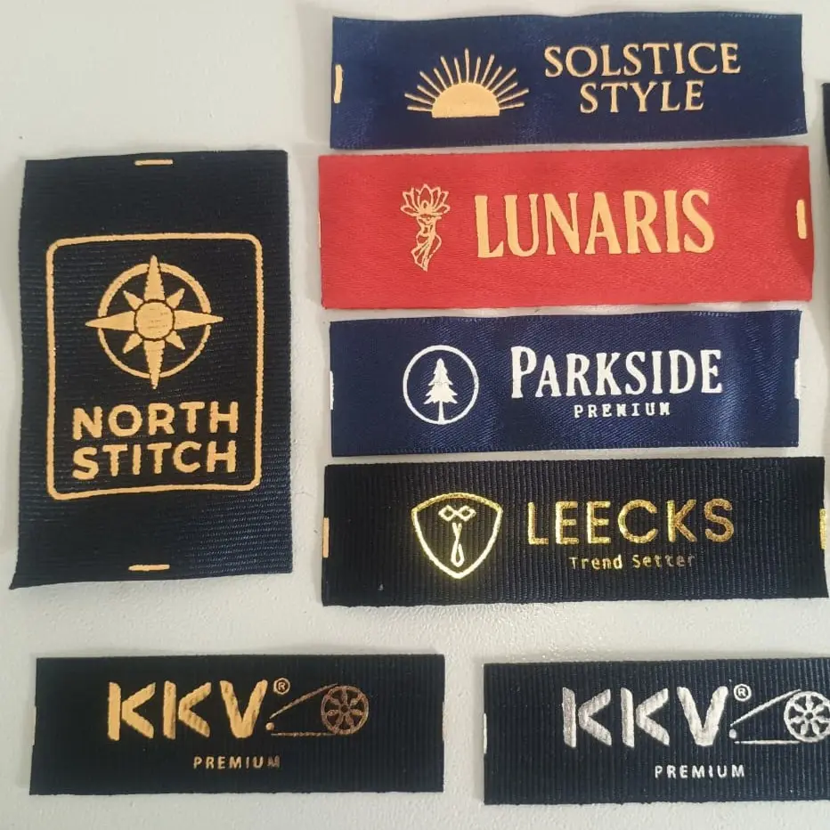 Printed textile labels arranged in a line